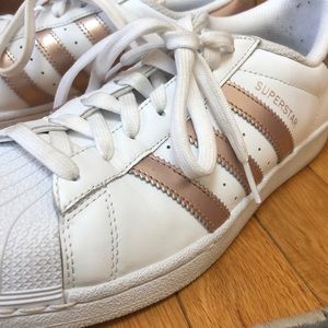 Rose gold Adidas Superstar sneakers